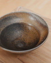 Load image into Gallery viewer, Black and brown ceramic bowl on a wooden surface
