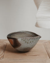 Load image into Gallery viewer, Wood fired ceramic pouring vessel with a textured surface on a wooden surface
