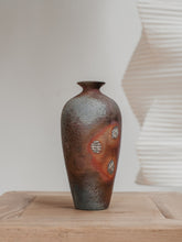Load image into Gallery viewer, Bottle-shaped vase with shell marked surface on a wooden table
